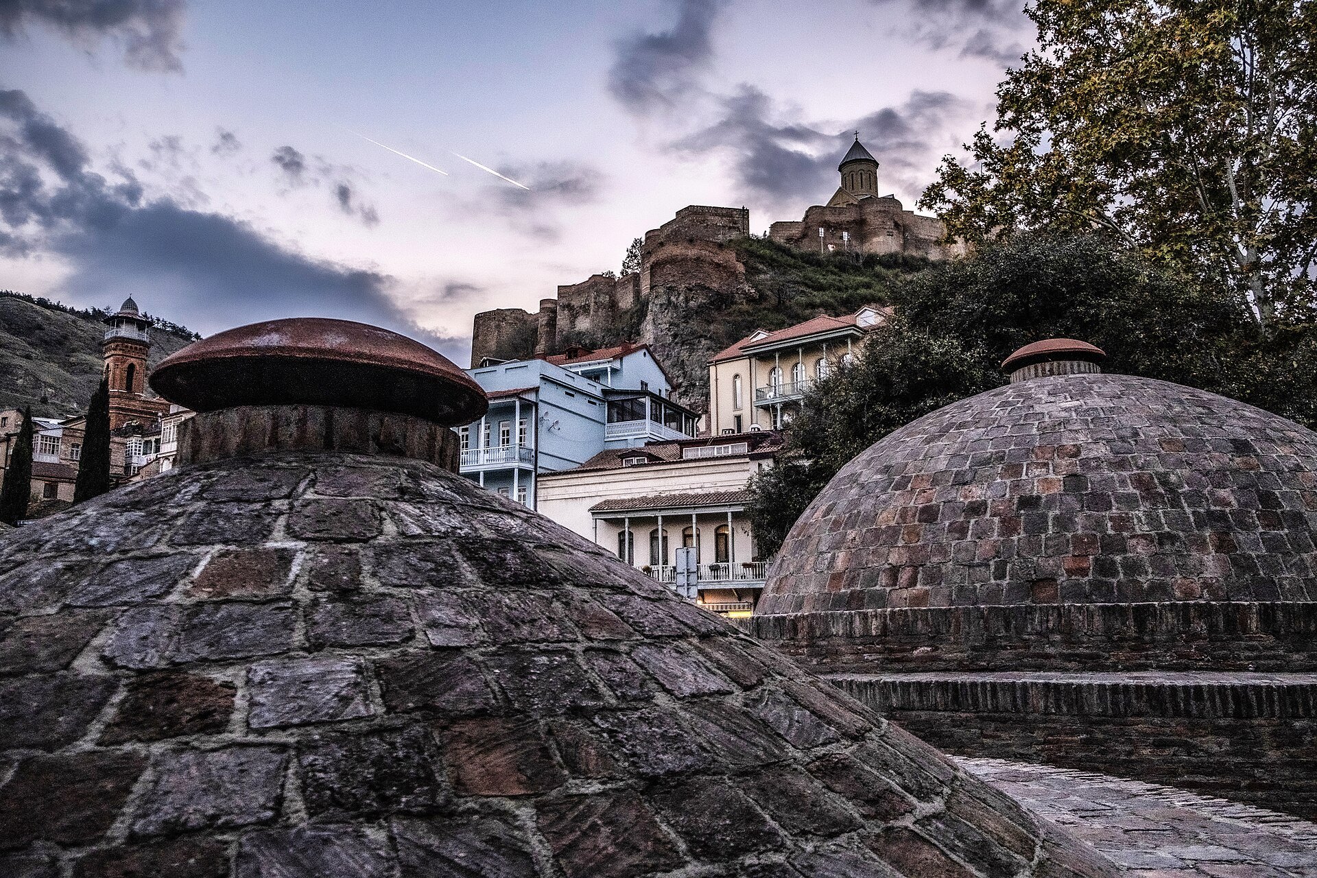 Brick domes of Tbilisi's sulfur baths under the old city hillside
